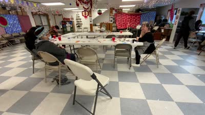 Diane Selanoff, Rhoda Moonin, and students singing Port Graham 2023