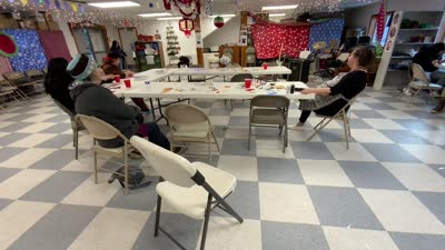 Diane Selanoff, Rhoda Moonin, and students singing Port Graham 2023