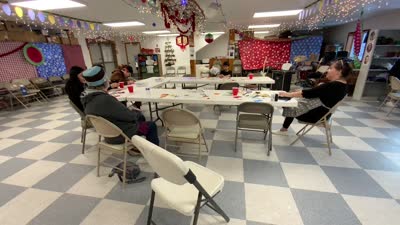 Diane Selanoff, Rhoda Moonin, and students singing Port Graham 2023