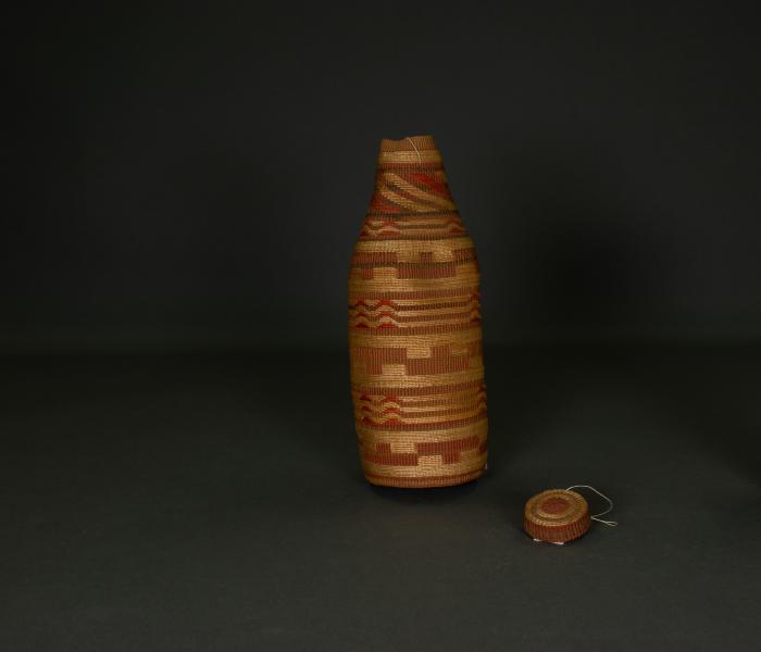 Bottle with lid (root weave)